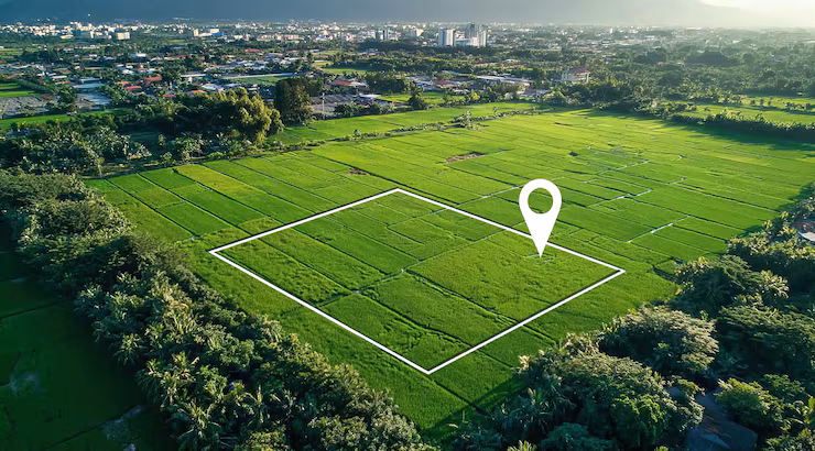 aerial-view-green-field-with-land-plot-location-pin_1119746-11389